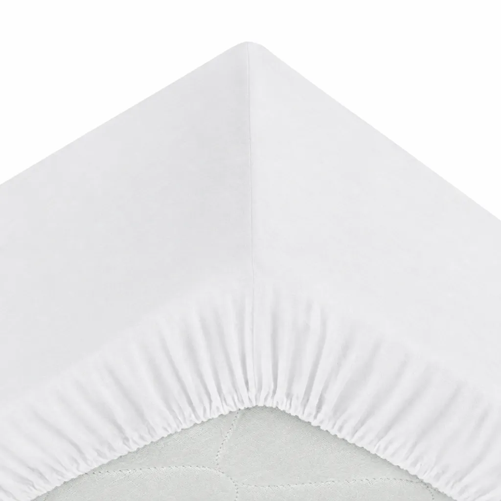 Coin de drap-housse blanc immaculé.webp